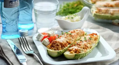 Zucchini stuffed with minced chicken, vegetables and quinoa
