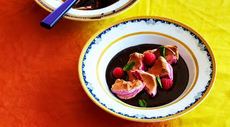 Raspberry soufflé in chocolate sauce