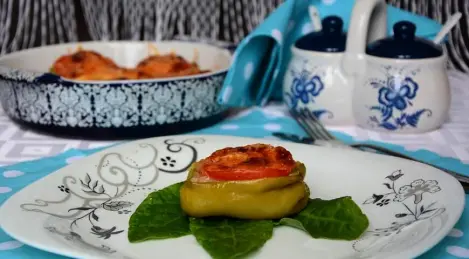 Peppers stuffed in halves in the oven with cheese