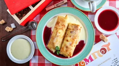 Pancakes with cottage cheese in creamy and raspberry sauce