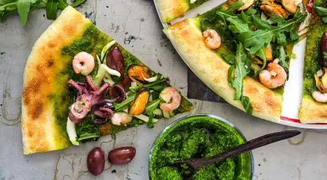 Pizza with pesto and seafood