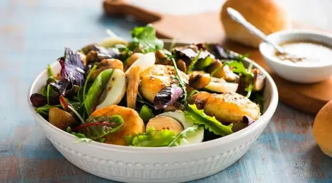 Salad with cheesecakes, mushrooms and eggs