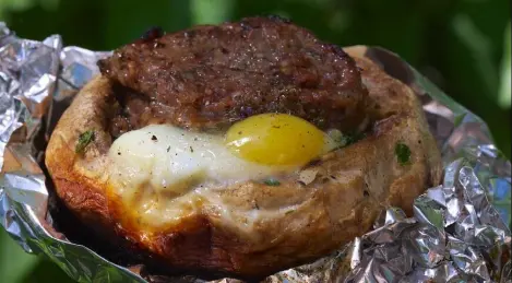 Meat in mushrooms on the grill