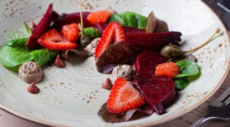 Salad with baby beets, truffle cheese and apple cider dressing