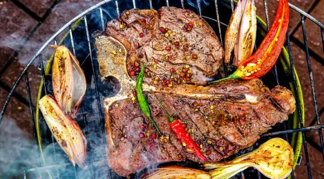 Grilled porterhouse steak with pepper sauce