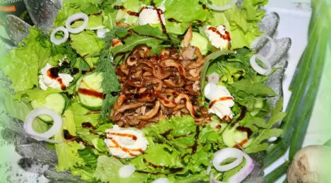 Assorted green salad with fried oyster mushrooms and cheese