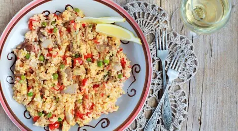 Paella with chicken and sausages