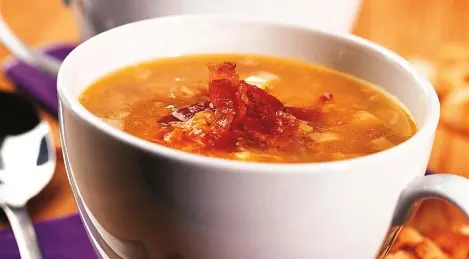 Pea soup with smoked meats in a saucepan