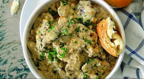 Chicken liver in sour cream with onions in a pan