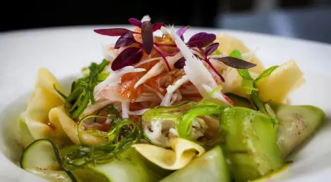 Salad with king crab, avocado and mango with banana yuzu sauce