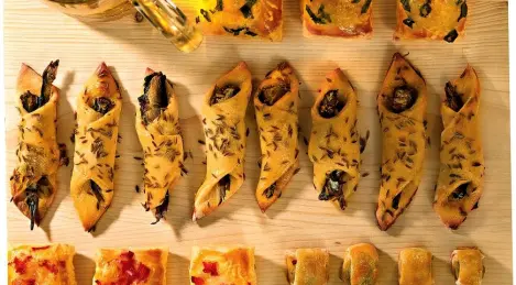 Envelopes with sprats and rolls with olives