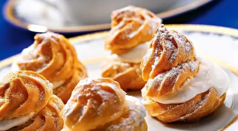 Profiteroles with orange jelly and whipped cream