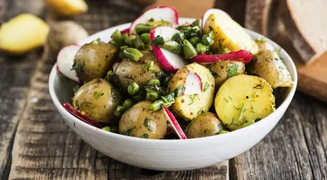 Potato salad with radish and peas