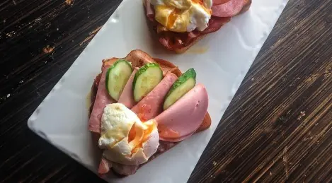 Sandwich with cold cuts and poached egg