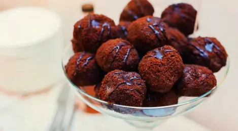 Sweets from condensed milk with nuts in caramel