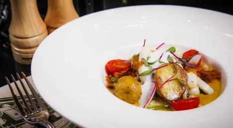 Grilled calamari with new potatoes and yellow pepper sauce.