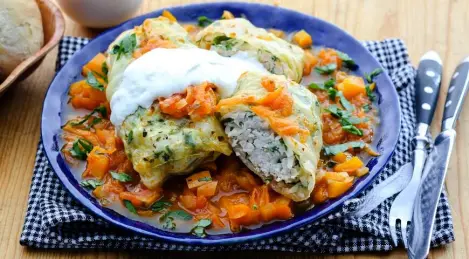 Stuffed cabbage rolls from young cabbage in a saucepan