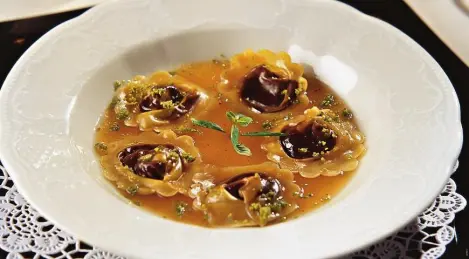 Chocolate dumplings with mango sauce