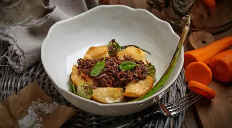 Beef tongue stroganoff on baked potatoes