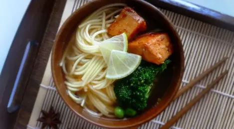 Soup with noodles and vegetables in Asian style