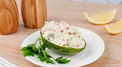 Salad with avocado and crab sticks
