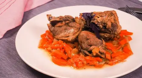 Duck stewed in a slow cooker with apples